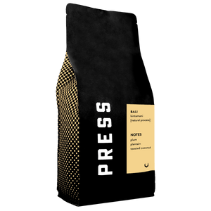 Black coffee bag with gold accents and 'PRESS' branding on a white background